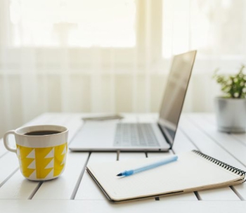 laptop and coffee mug and notepad